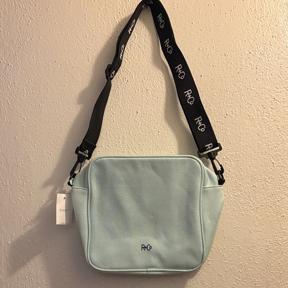 R+Co Sky Blue Crossbody Cosmetic Bag with Black Strap